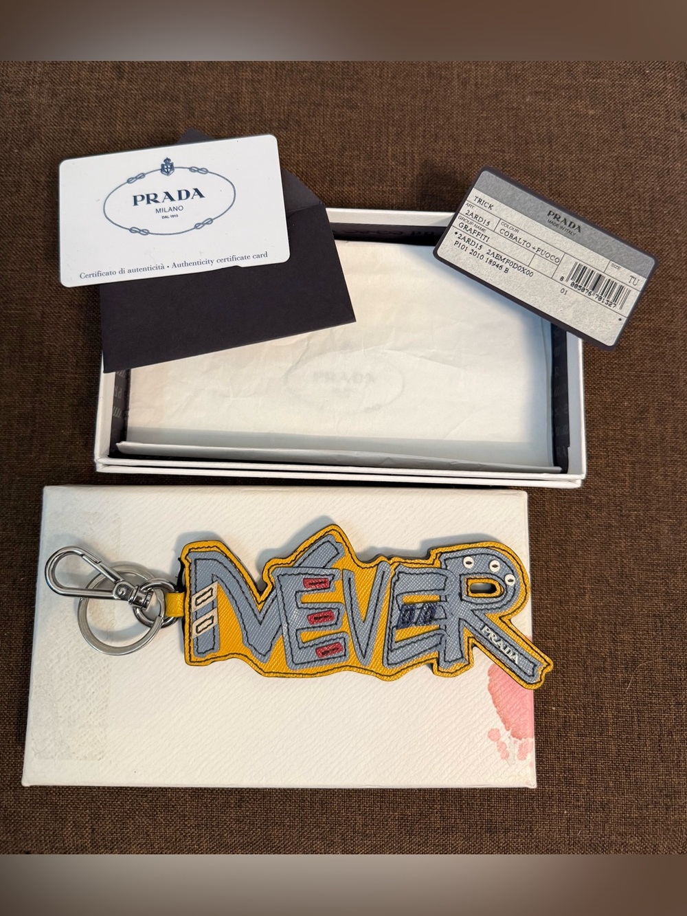 Authentic “NEVER” Prada Saffiano Leather Graffiti Keychain / Bag Charm with COA